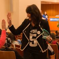 Image of Dr. Mantella high-fiving audience member